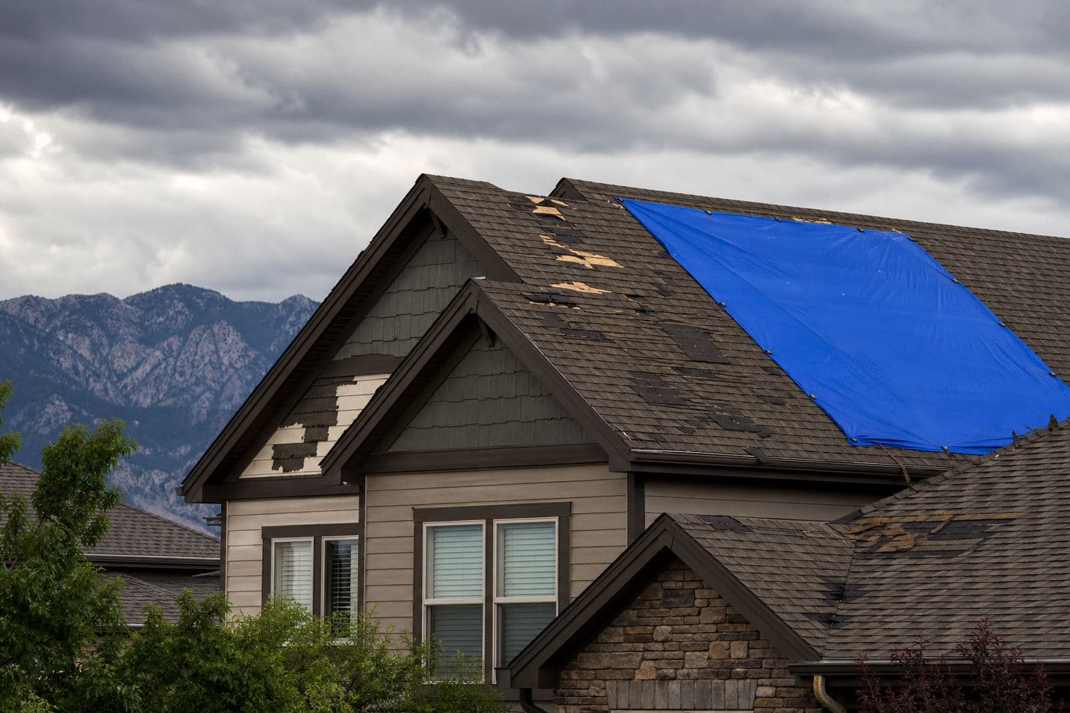 Denver Roof Replacement or Temporary Tarp: How to Make the Right Call After Roof Damage